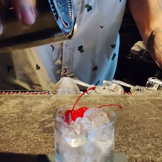 It's a hot one! Come in and cool off with a Midori Sour 🍈! #summercocktails #midorisour #summer #beattheheat