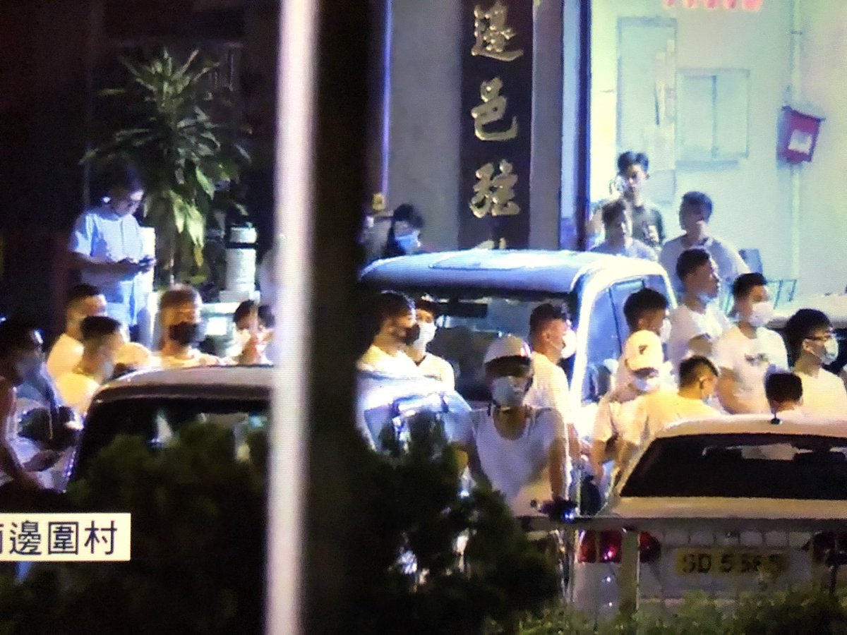 there’s some heckling going on between thugs and people standing on the other side of the no mans land. here’s some close ups of them smoking, swinging their wooden sticks, chatting