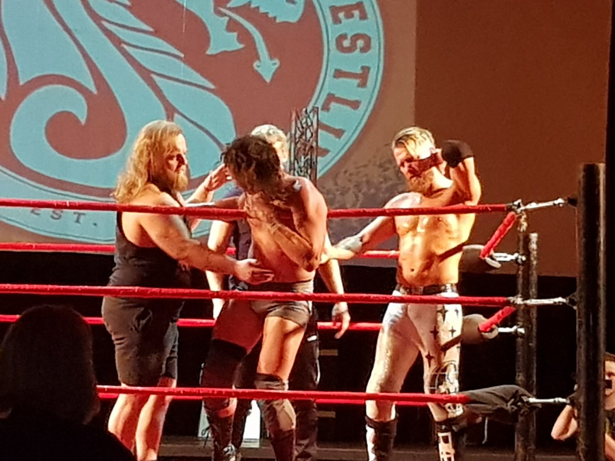 PhilJones77's tweet photo. White &amp; Jones continue the assault post-match only for @Flash_Morgan and @WILDBOARhitch #The198 to run them off! 
@UKDragonPro #HighNoon https://t.co/Yv10tvrgMI