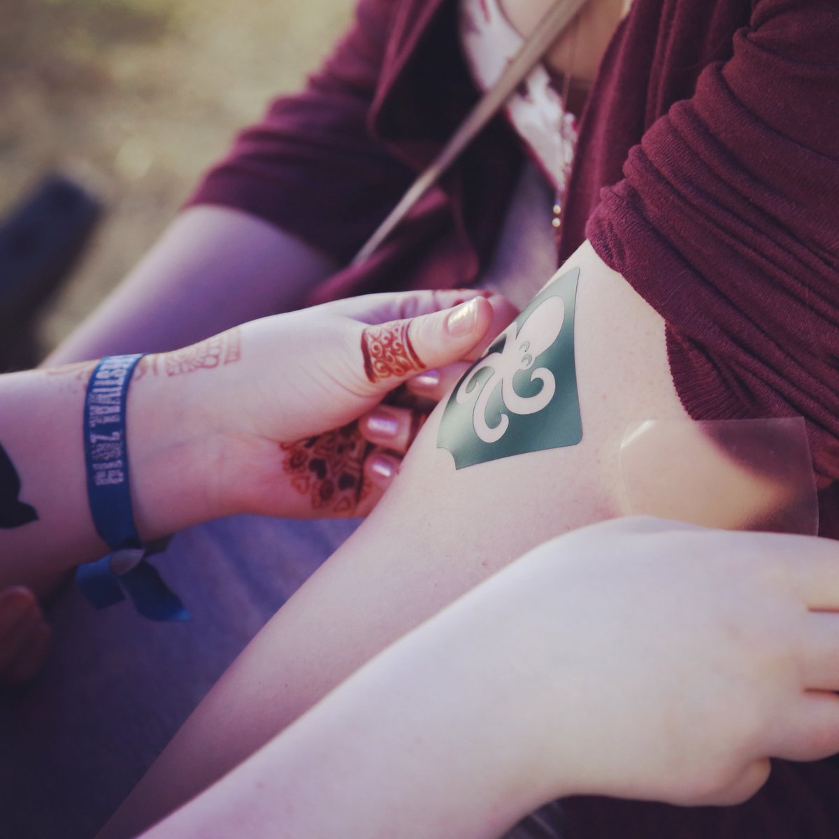 Festivals and glitter tattoos go together like...