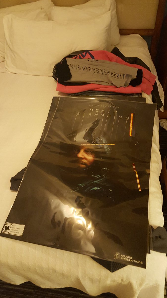 So in Mr. Kojima doesn't fuck around news, here's the size of the free poster I've gotta fit in my bag. #nomanleftbehind