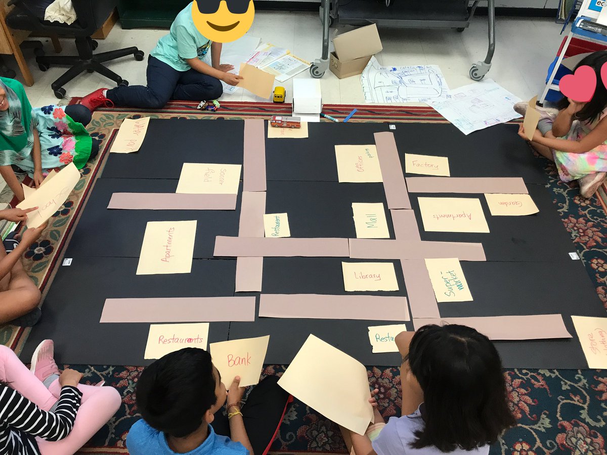 Angel04brea's tweet photo. After considering various city plans, we took turns putting down the roads and buildings. We are well on our way to building a great city. #summerTDSB #STEMeducation @QVicSummer @TDSB_STEM https://t.co/mwLx5Nx9CD