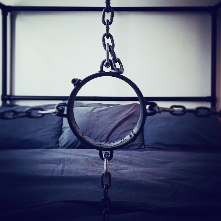 MisterCage3's tweet photo. Our facilities include a bespoke, hand-made, emperor sized steel four poster bed featuring a memory foam mattress, suspended steel #collar, chains and clamps for device #bondage. It’s a lot more comfortable than it sounds! #luxuryBDSM https://t.co/F1xkBNFs3x