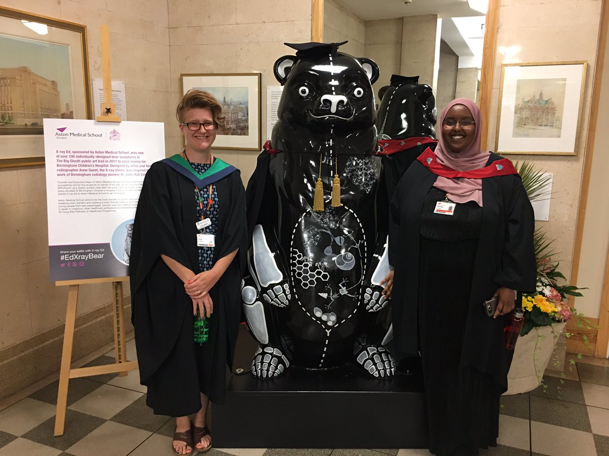 MarkJPearson's tweet photo. Emma and Ashwaaq from @AstonMedicine helping out at @AstonUniversity graduation today.  Well done to all who are graduating. Only 4 more years and we’ll see our first cohort enjoying the celebrations too!! #Graduation2019 #EdXrayBear #astonmedicalschool #astonuniversity https://t.co/6KkCCBFgJv