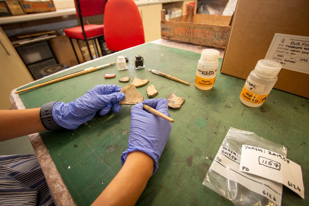 YArchaeology's tweet photo. Becky from #YATCollections is marking Roman and Medieval pottery from a recent watching brief in the centre of York. All pottery sherds are marked using a Paraloid solution and india ink. #ADayInArchaeology https://t.co/nvb9NhocOl