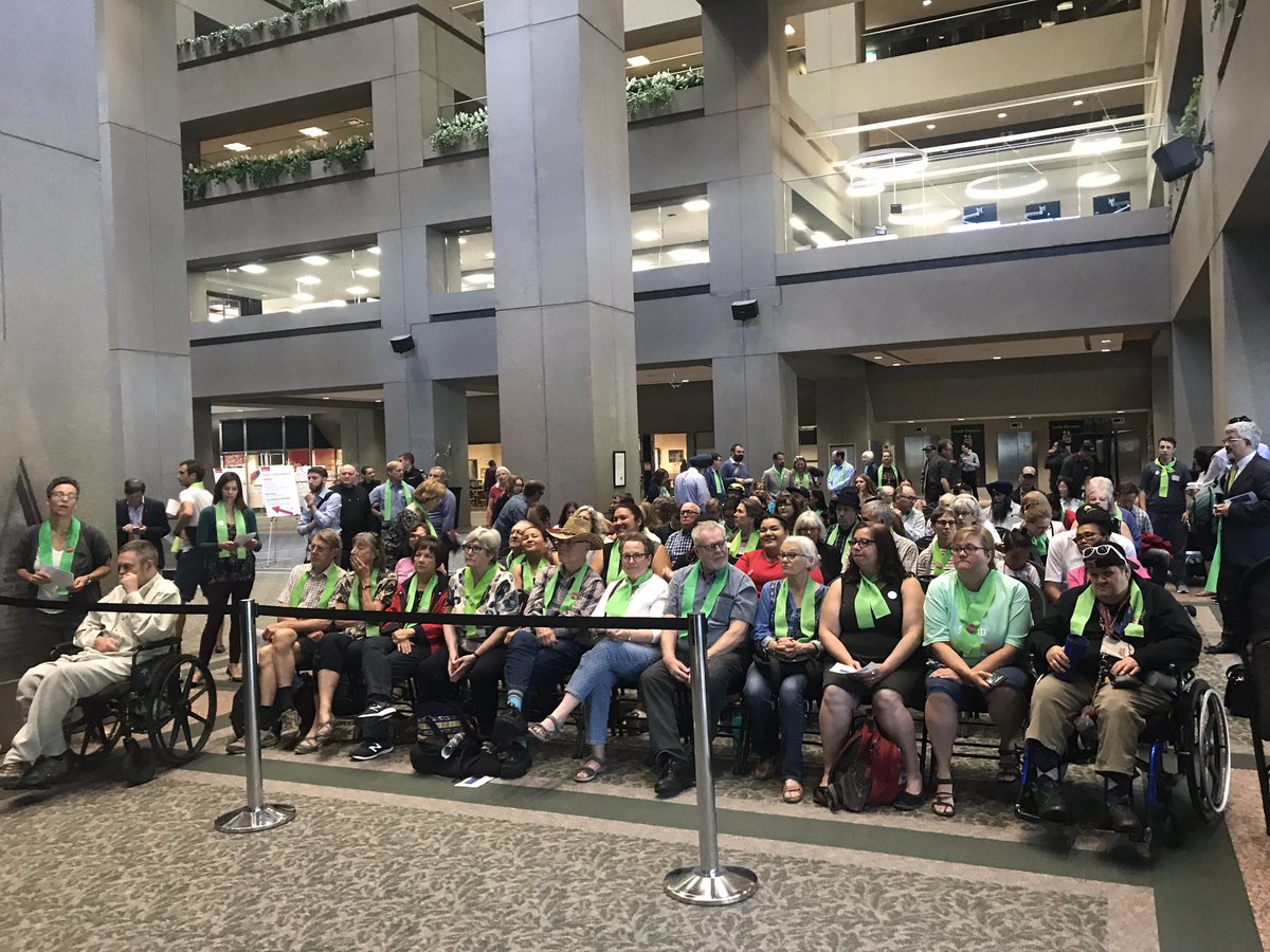 Salilam's tweet photo. Check out the overflow crowd outside #cityhall #yyccc #enoughforall. Warms my heart to see so many folks showing up to ensure we #keepcalgarystrong @VibrantCalgary @momentumcalgary #endpoverty #transit https://t.co/UZVT2CvZJu