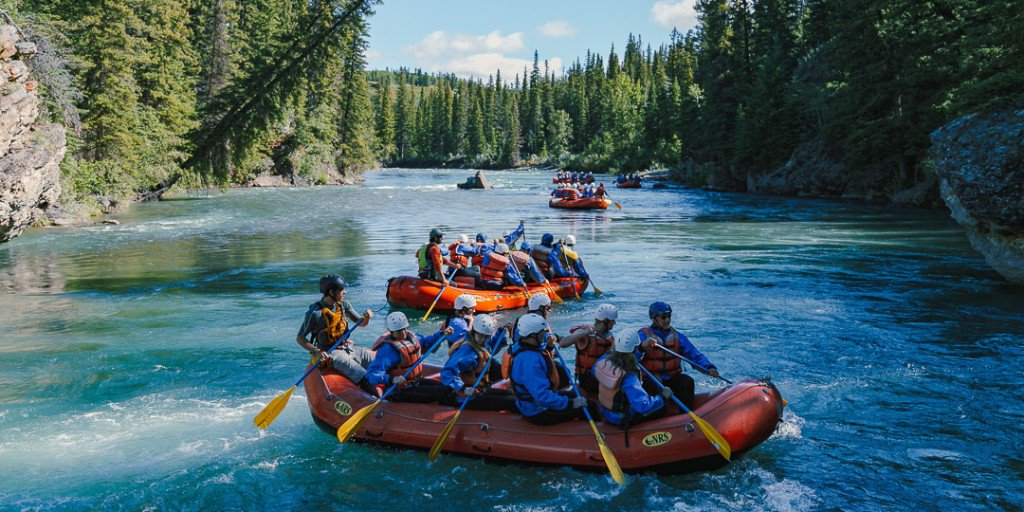 CanrockRafting's tweet photo. A horde of wild rafters moving down towards action on the Kananaskis whitewater tour. Water fights are very much allowed https://t.co/VUyl5MxdWW