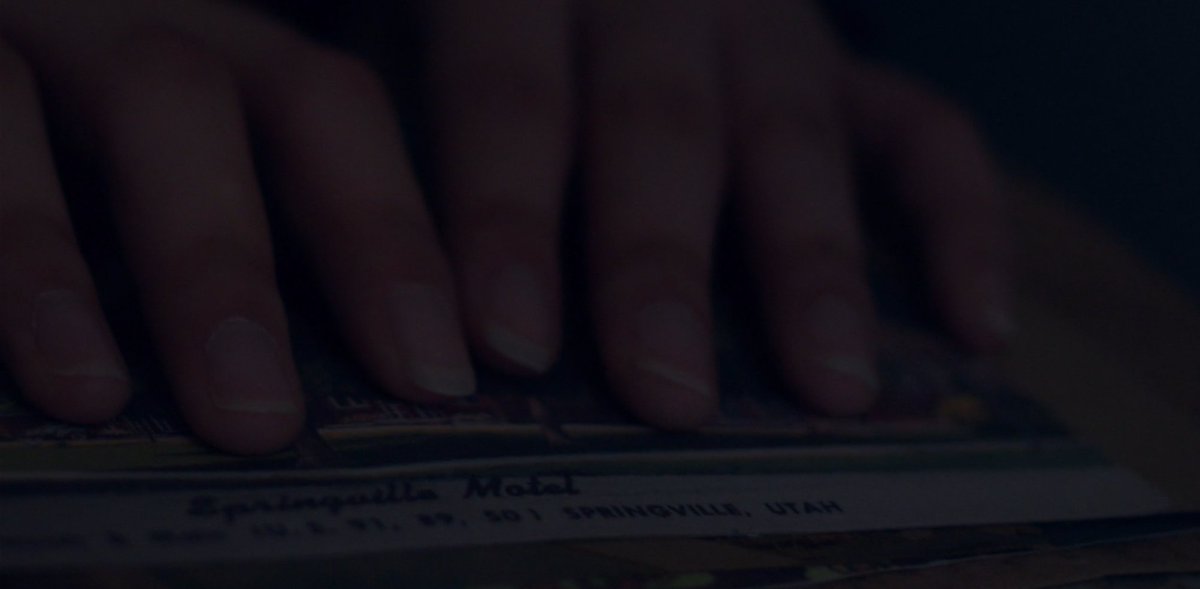 Maybe the sadness and loneliness she sings about as a result of not being noticed by the one she cares for is because she met that same person in another timeline, but in this timeline they don't recognize her. She considers giving him the letters but he won't know what they mean