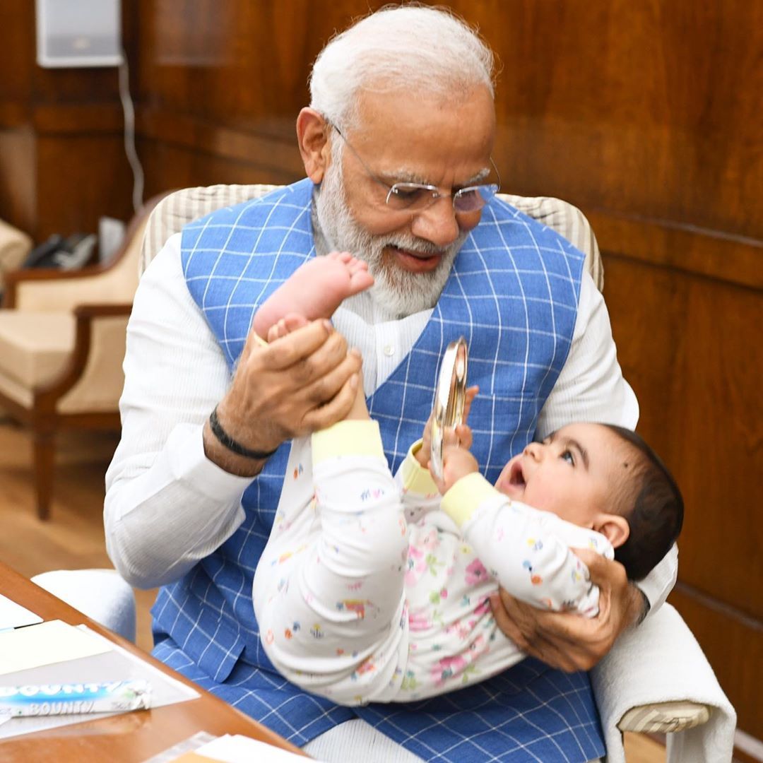 PeoplesGovIN's tweet photo. PM Narendra Modi shared a Photo with a 'Special Friend' in Parliament. @narendramodi 

The child giggling away in Modi's arms is senior BJP leader Dr. Satyanarayan Jatiya's grandson. https://t.co/uiDrIaN4jB
