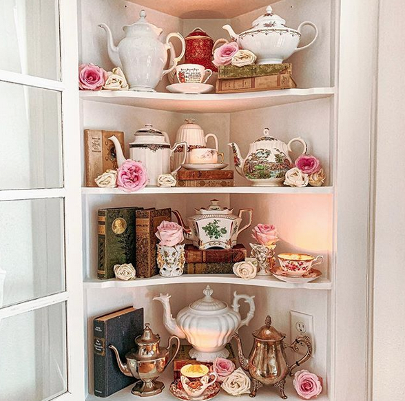 TeaTimeMag's tweet photo. This beautiful tea cabinet filled with precious china, antique novels, and floral touches is the perfect cozy corner to dedicate to #teatime. We’d love to have @mspeacockantiques’ lovely collection in our home. #Repost #TeaTimeMagazine #TeaCorner #TeaTime #ChinaCollection https://t.co/if4IKkB8Km