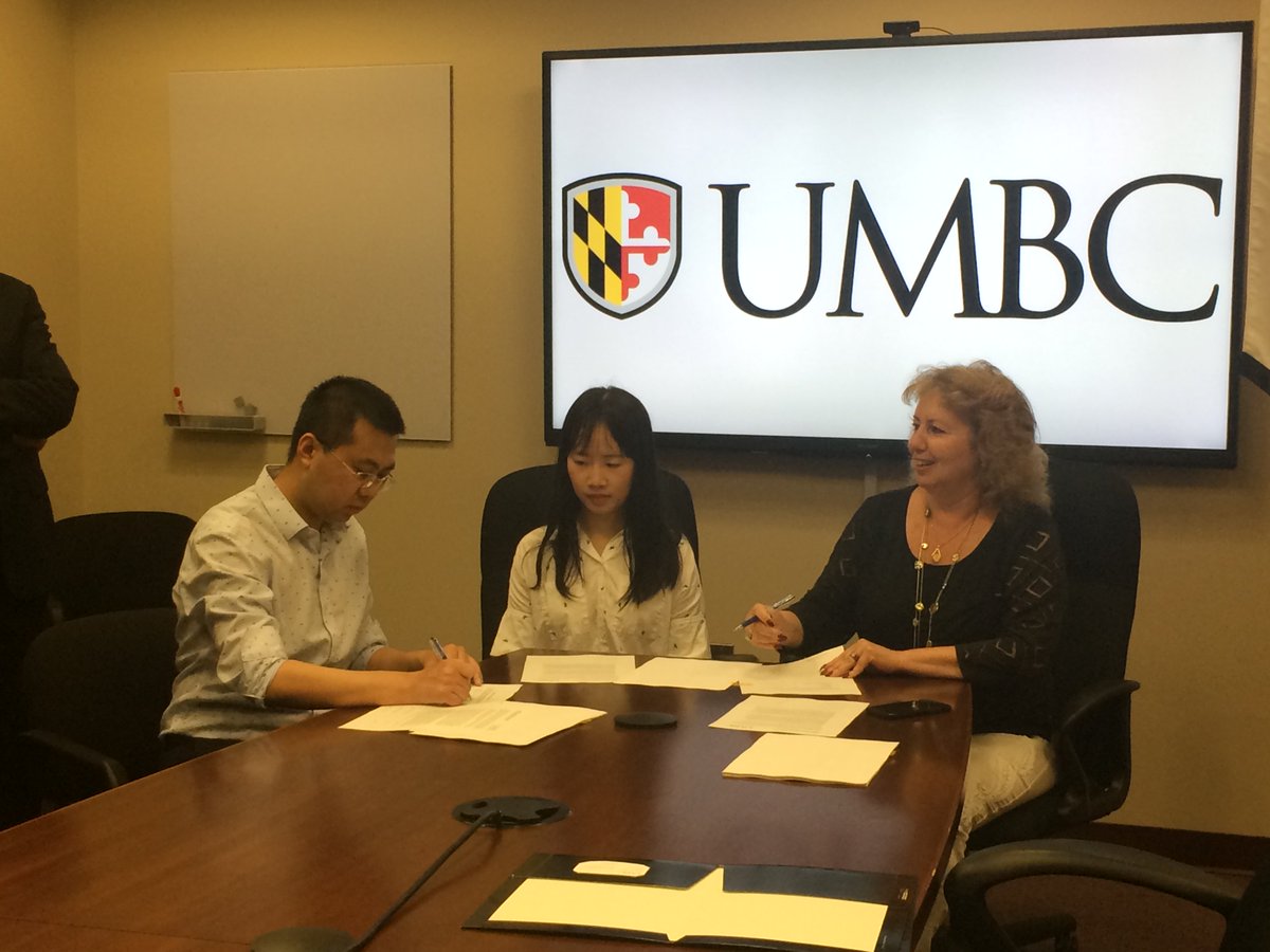 UMBC's tweet image. Several @umbccsee and @umbcinfosystems faculty signed an express license agreement for their company Softhread, Inc., which developed innovative blockchain technology. #UMBCcomputing #UMBCinformation