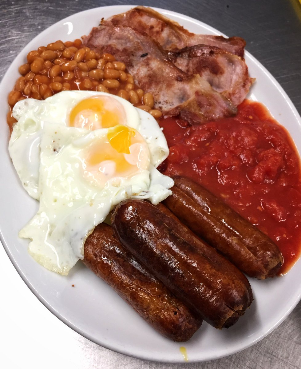 SnapBoxCafe's tweet image. Belly Buster Breakfast customised for the customers taste by removing black pudding and mushrooms. This particular breakfast has 3 Bacon, 3 Sausage, 2 Egg, Tomatoes, Beans, 2 slices of toast or fried bread or bread and butter and cup of tea or coffee 🥓🍳🍅🍞☕️