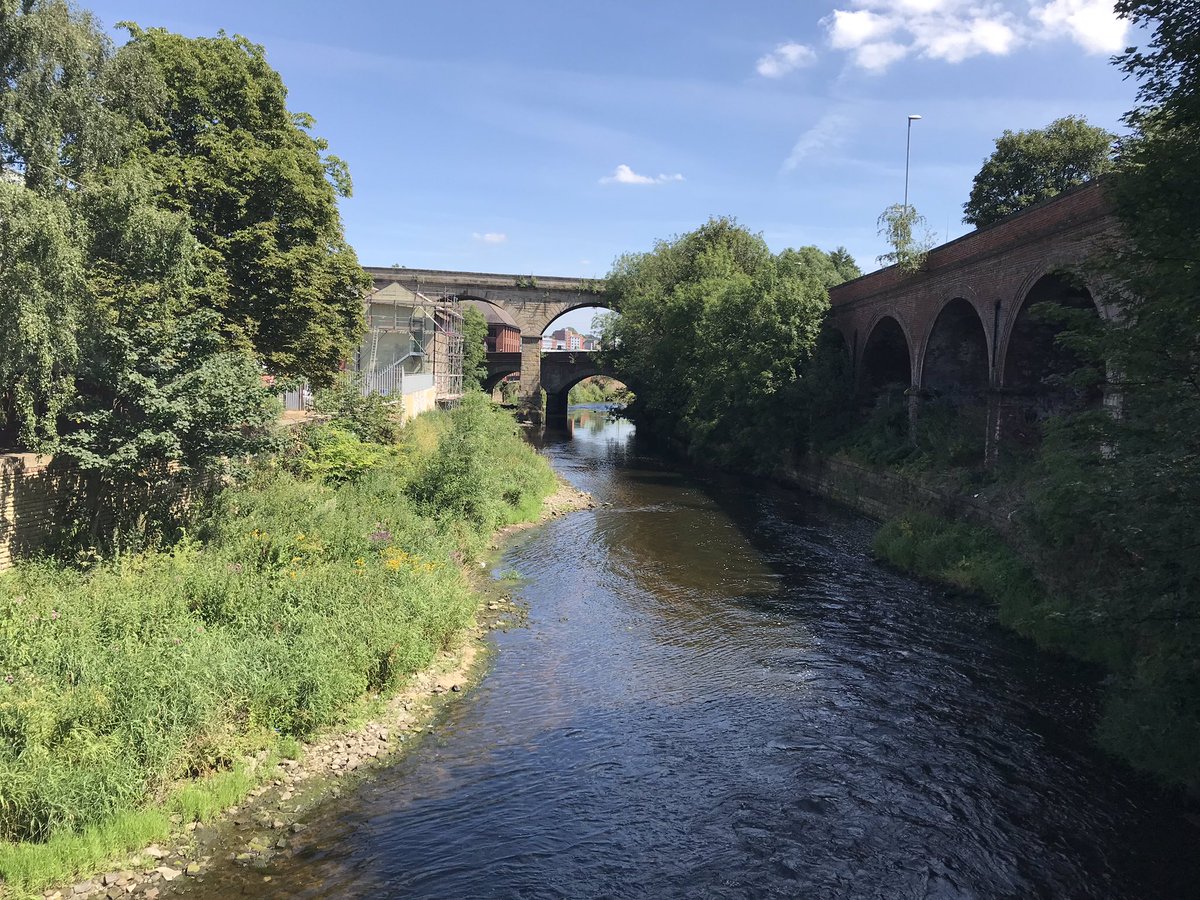 OliverHarmar's tweet photo. A sunny day in Leeds seeing the moveable weir &amp; new bridge at #Knostrop, one part of the innovative scheme providing vital protection &amp; enabling huge redevelopment along the #Aire. Then at #Armley Mills - part of the exciting major plans for phase 2 https://t.co/5FRhSnrMyj