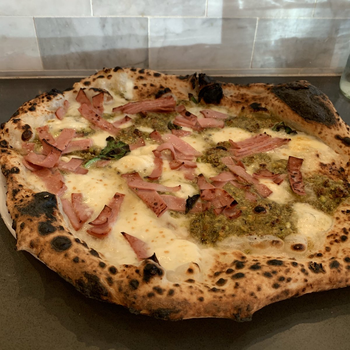 Zizzamia's tweet photo. Pistachio 🍕 
Fior di latte, mozzarella, cream of pistachio, Italian mortadella, basil 🌿 https://t.co/IHtbgs4EU1