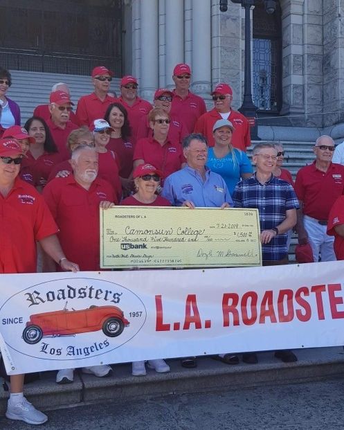 Camosun's tweet photo. Members of the #LARoadsters Car Club gathered on the steps of the BC Legislature on Sunday to present a generous donation of $1500 in support of #Camosun's Automotive shop and its reputation for training the next generation of skilled automotive technicians in our region! https://t.co/EGQeJ6X5sr