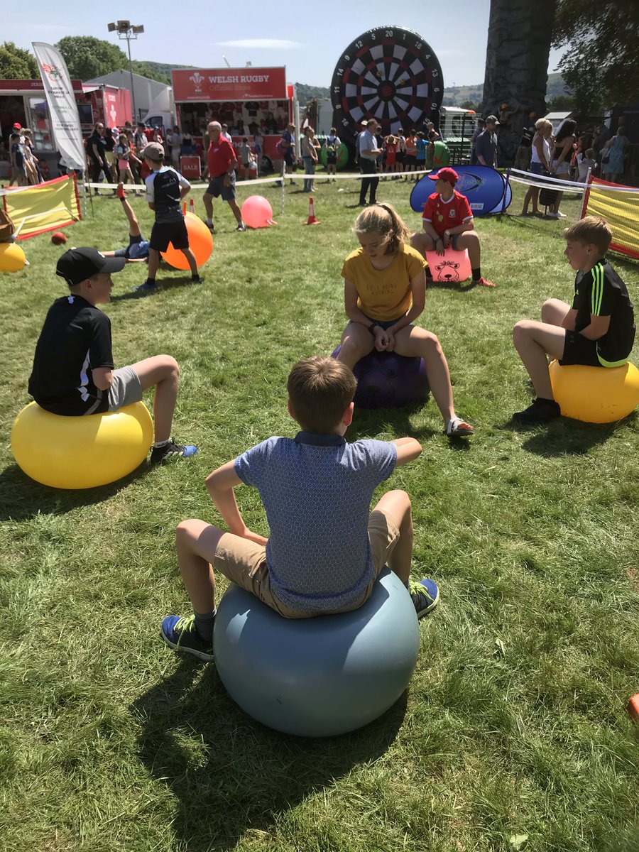 worldaltgames's tweet photo. Day three of the fantastic #RoyalWelshShow in #Builth. The #WorldAlternativeGames team are situated in the #SportsVillage. If you’re coming along, do come and join in the fun of our activities at 1030, 1230, 1545: spacehoppers, plank racing, horseshoe throwing. Fun for ALL ages! https://t.co/jJFRs0jHMV
