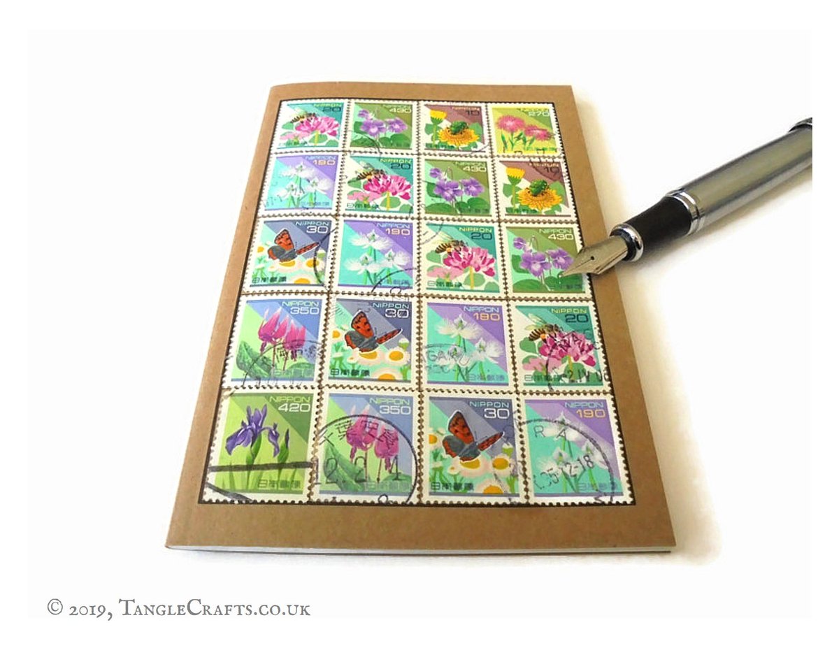 TangleCrafts's tweet photo. Japanese #stamps really lend themselves to striking design arrangements! This new addition to my 'stamp album' #notebook range features #flowers, #butterflies & #bees - perfect for garden or travel notes https://t.co/PTgw8N6mxR #recyclednotebook #upcycledstamps #japanesestamps https://t.co/4dIC2QWljF
