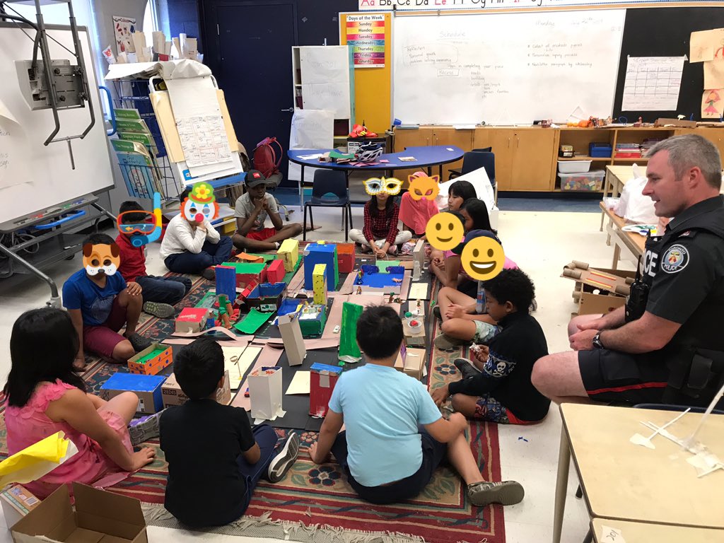 Angel04brea's tweet photo. Officer Gribbon visiting our class to see the community we are building. Kids are so excited to tell him everything we have made so far. Thanks for coming! @PCGRIBBON9552 @TDSB_STEM @QVicSummer #summerTDSB https://t.co/QycfC8admp
