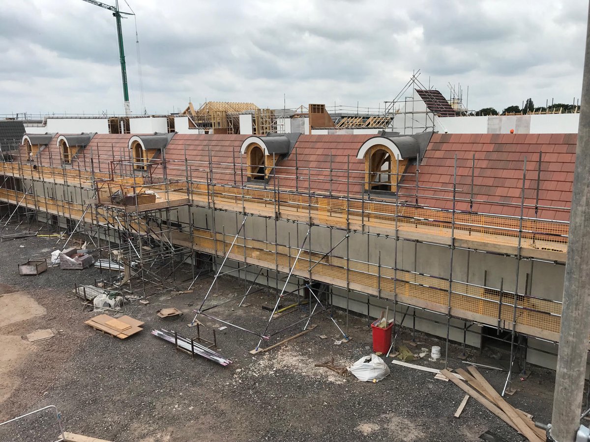 Tiling has commenced at Mill Green Outlet Village in Cannock, with <a href="/NRA_Roofing_LTD/">NRA Roofing</a>.  This retail scheme, designed by Holder Mathias #Architects and constructed by Bowmer and Kirkland, will total around 9000m2 of #roof tiling, utilising 5 tile profiles from Forticrete. #roofing