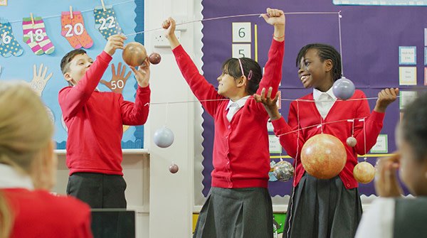 School students working together in a STEM lesson.