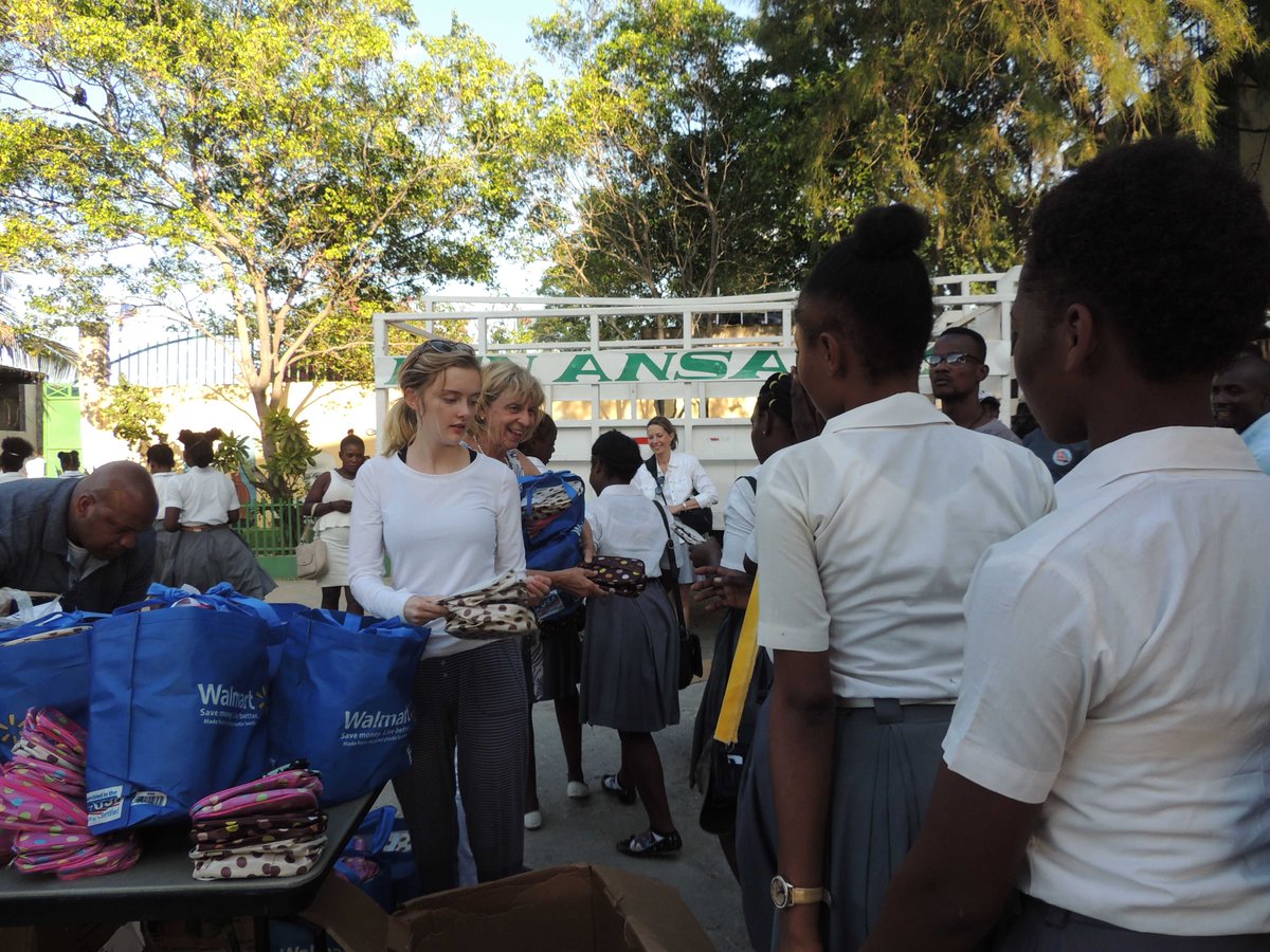 Gov &amp; Mrs. DeWine &amp; family hand out gifts to the children in Cite Soleil