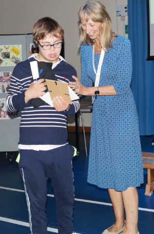 TheMilestoneSch's tweet photo. To rapturous applause #Kyle & #Joey receive #photos #scrolls and their #Leavers2019 t-shirts from #LynDance #HeadTeacher for all their time @TheMilestoneSch https://t.co/zu53b5JxP0