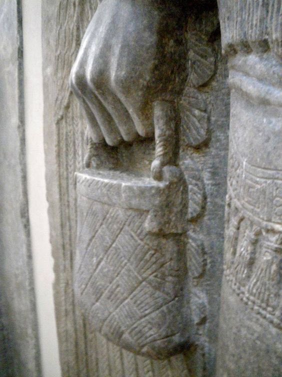 The bags show up everywhere. No one really knows what they are or what they represent, but they’re always carried by “The Gods.”