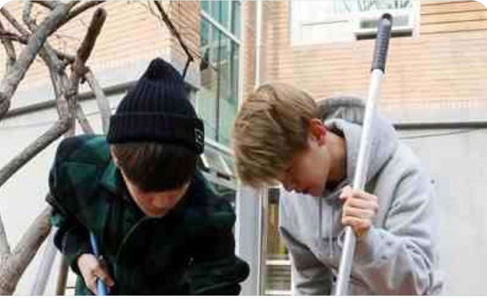 Baekhyun mopping the cafeteria floor of Hwangsimni-dong's child welfare facility care along with Jongin