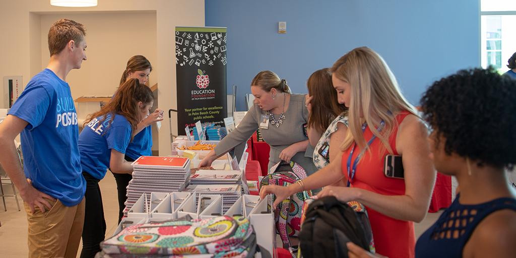 carrier's tweet photo. Today is #NationalInternDay! Our interns are giving back to the community by hosting an employee school-supply drive and backpack assembly event. 100 backpacks will benefit 4 classrooms supported by the @EducationFdnPBC through its Red Apple Supplies Program. #BuildingPossible https://t.co/F5WeZq7lj7