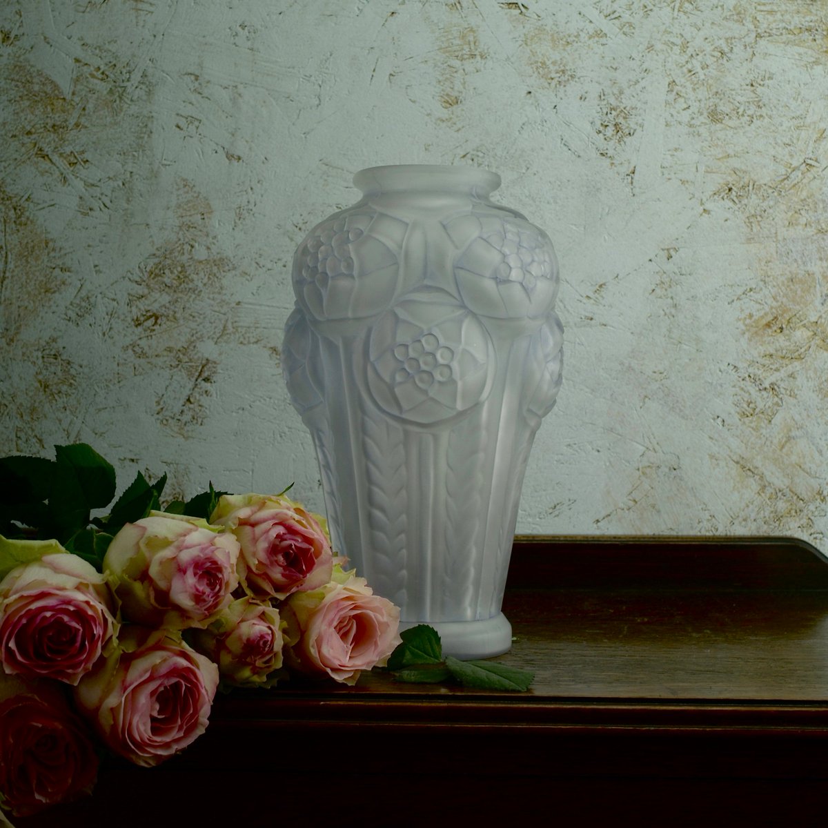 Perfect for a warm day.  This cool blue Art Deco opalescent glass vase with pretty plant motifs. More details on our website: coindeparadis.co.uk