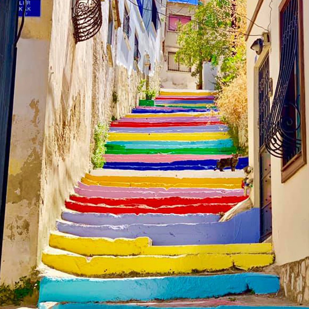 Explore the city of Kuşadası, Turkey with #RegentCruises and enjoy the umbrella sky and multi-colored vibrant steps painted in locations across the city. 📸: Paul Reynolds #ExperienceRegent
