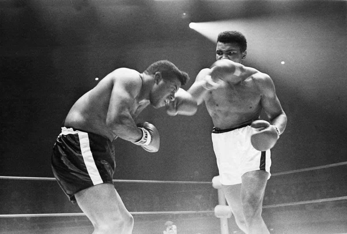 Boxing great Muhammad Ali is photographed in full swing against opponent Floyd Patterson in December 1965 fight. (Herbert Nipson/ Johnson Publishing Company). This digital image is owned by Johnson Publishing Co. Reproduction forbidden without special permission.