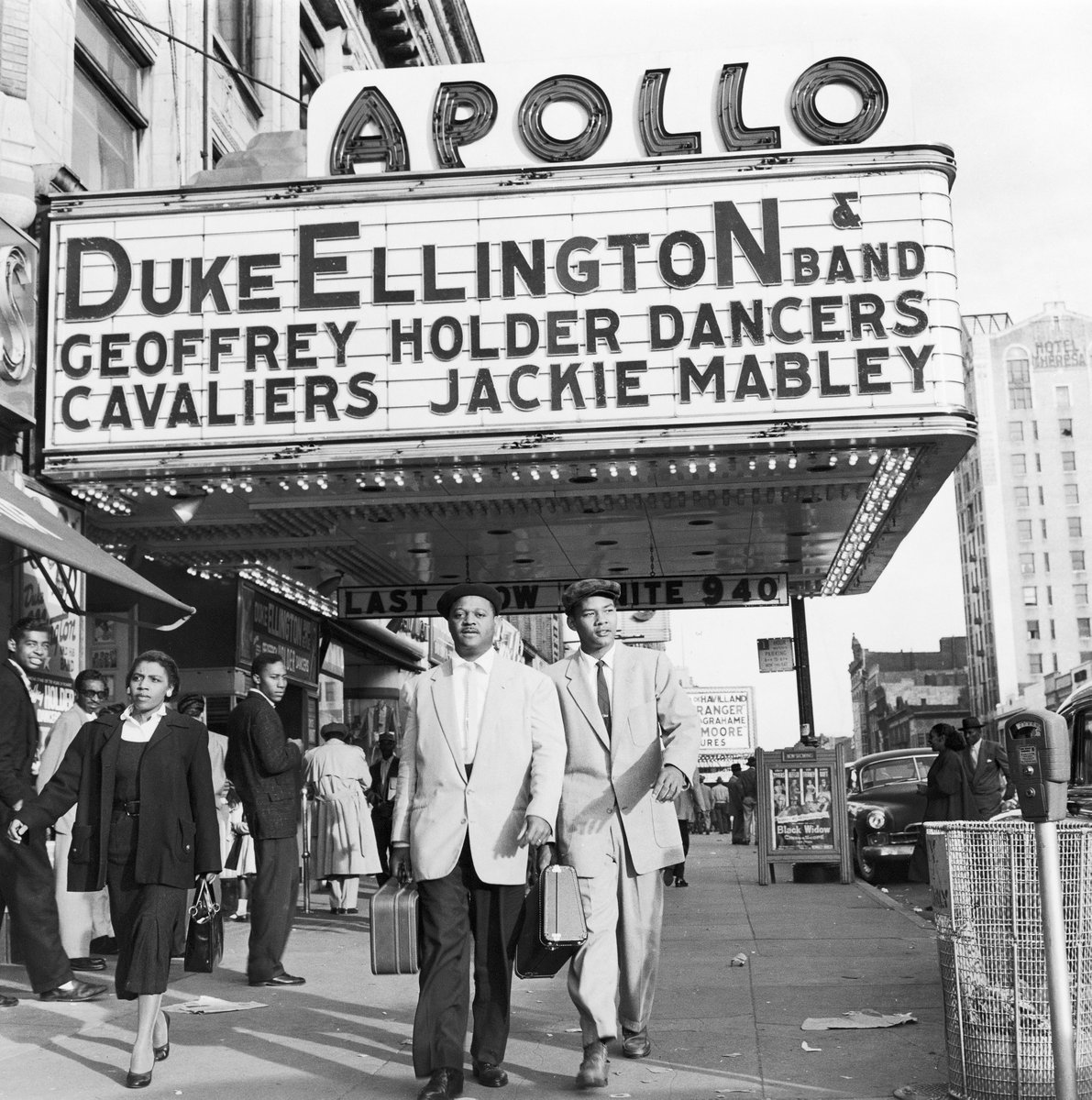 Clark Terry walks with his son Rudolph under the Apollo Theater marquee after Terry's first stage show with Duke Ellington's band in 1955. (G. Marshall Wilson/Johnson Publishing Company). This digital image is owned by Johnson Publishing Co. Reproduction forbidden without special permission.