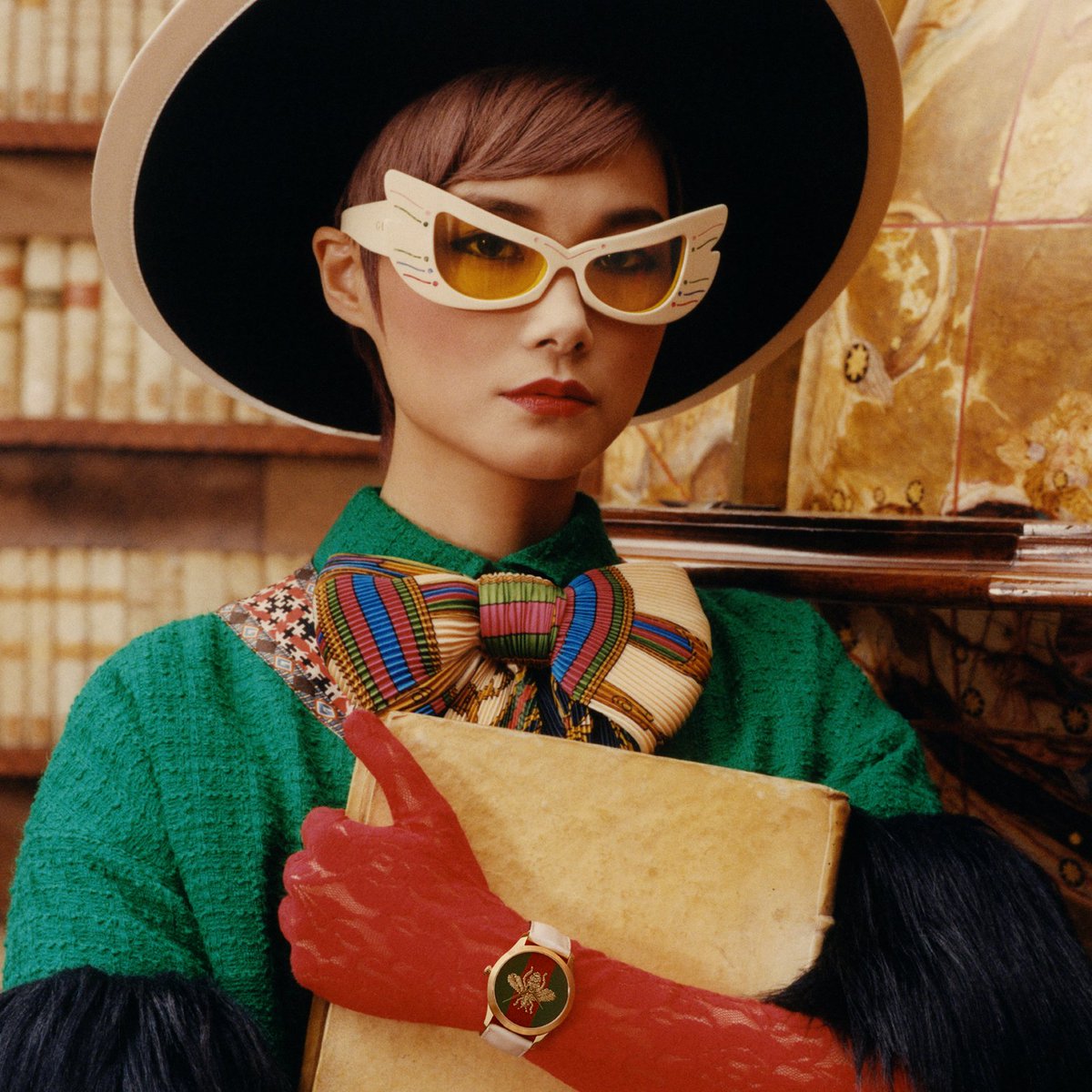 gucci's tweet photo. Images from the #GucciTimepieces and #GucciJewelry campaign featuring #ChrisLee. Captured inside Biblioteca Casanatense in Rome, the singer and actress wears the House’s new watch and jewelry creations designed by #AlessandroMichele. Watch the video https://t.co/dyKCZjkznq https://t.co/jZ3BFTet48