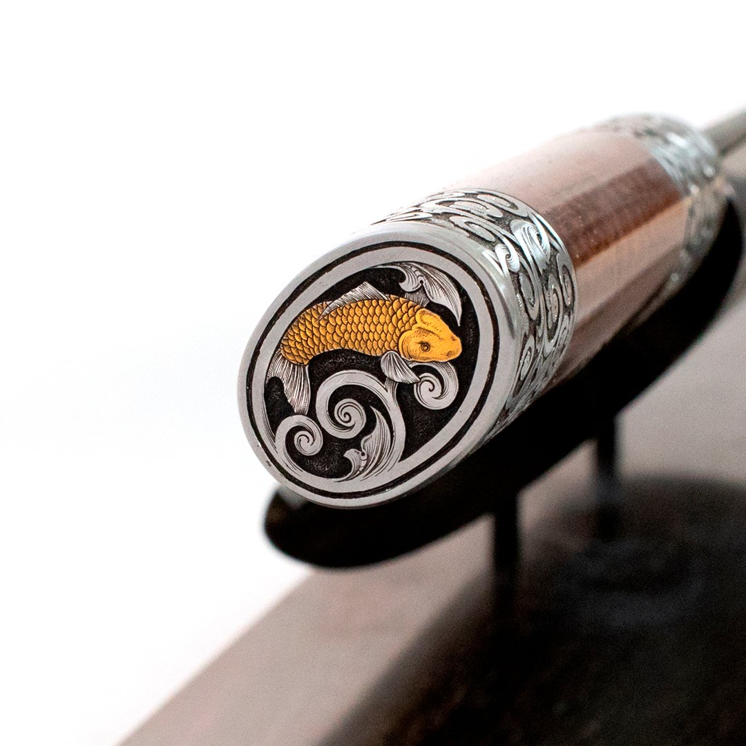 Kintaro's Dream
4 hr Auction - July 30th, 2019
Starts at 10:00 am PST

Featuring a Koi engraved plug weld, 500+ layered Damascus blade with a Snakewood handle. Engraving and gold inlay by Mastersmith Tom Ferry.