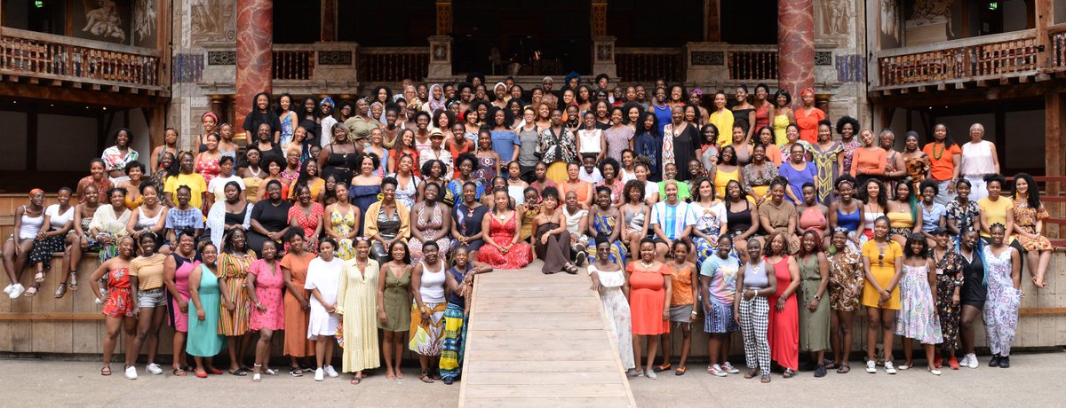 Approximately 250 Black Womxn stood on and at the base of the Globe theatre stage
