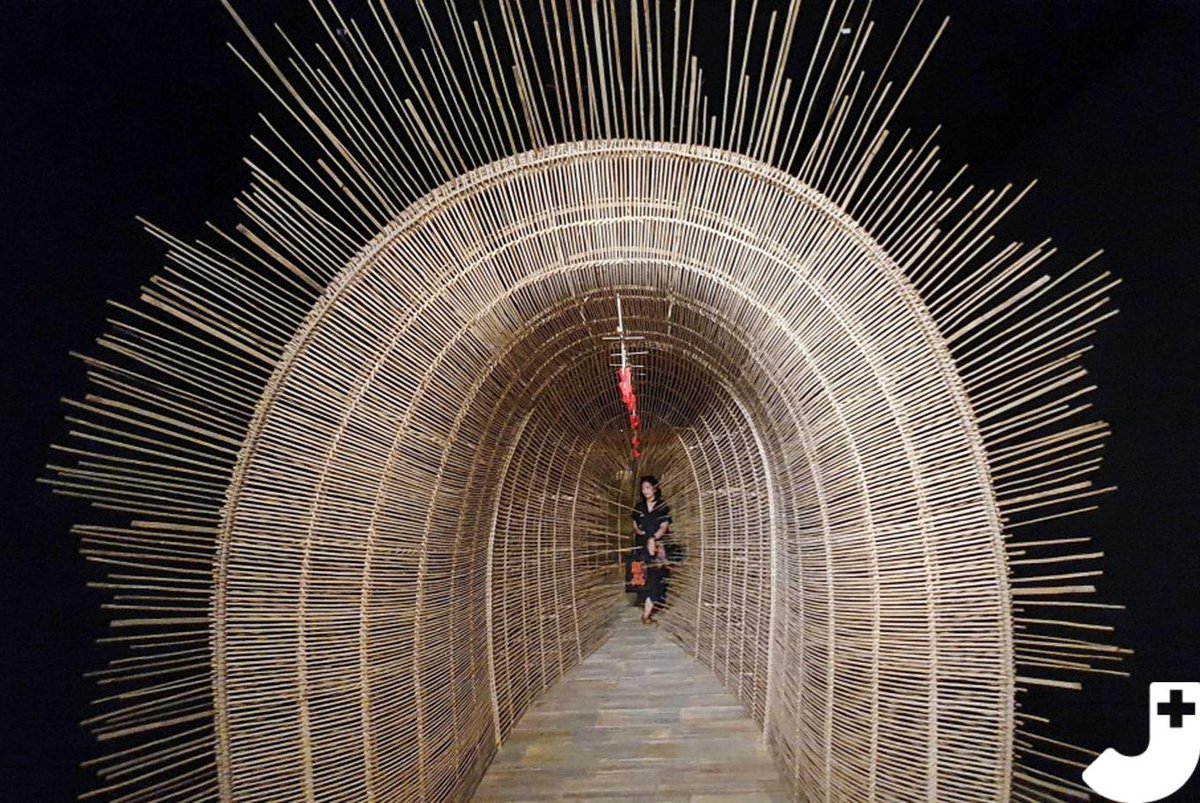 A tunnelshaped bamboo art installation is on display at ArtJog 2019 in