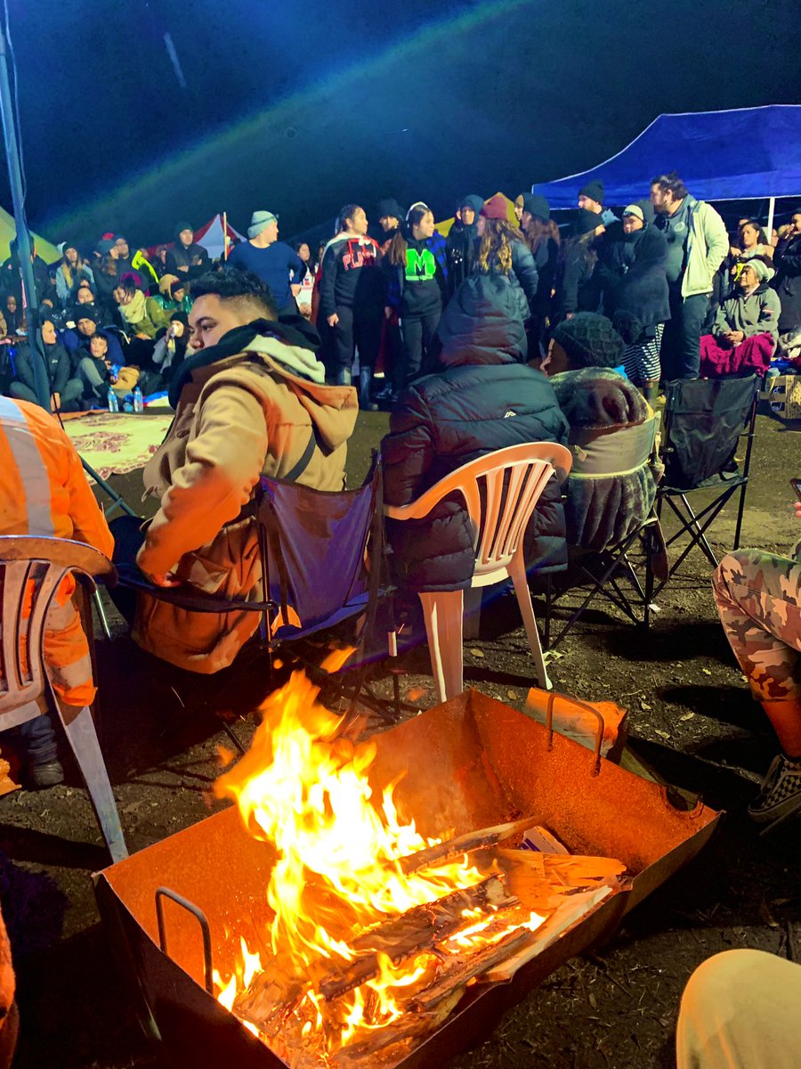 KiwiDiva's tweet photo. I’ve been trying to get my cuz to get this fire going for ages and finally he has listened. We are warm now whānau. Ngā mihi to everyone that donated firewood & kindling.🔥
#protectihumātao
#protectorsnotprotesters https://t.co/NXZWBmvOpc