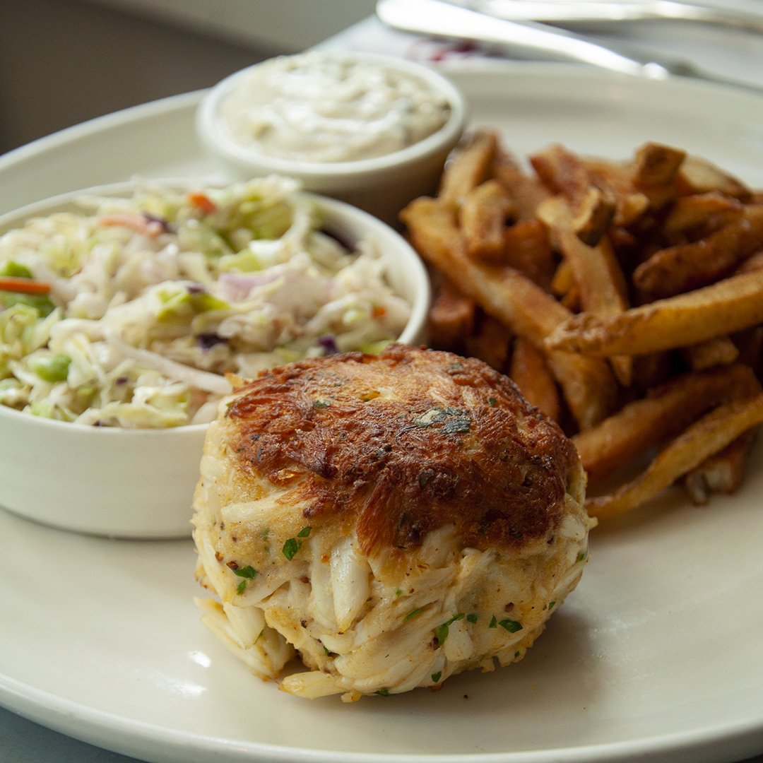 JohnnysBmore's tweet photo. The finished product! Jumbo Lump Maryland Crabcake with coleslaw and fries. Classic. #marylandseafood #eatfresh #eatlocal #johnnysbmore #rolandpark #mybmore https://t.co/dSIUrX9Cy9