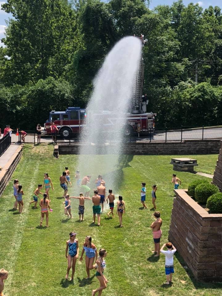 macstlouis's tweet photo. Sometimes described as the "best day of summer camp", @westcountyfire came by to spray down the Camp MAC kids #MACcamp #summerfun https://t.co/6nnSA5ZrIB
