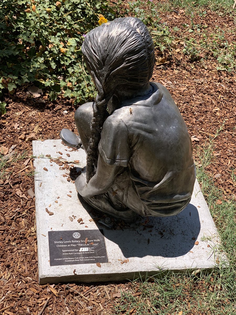 Statue of girl with magnifying glass