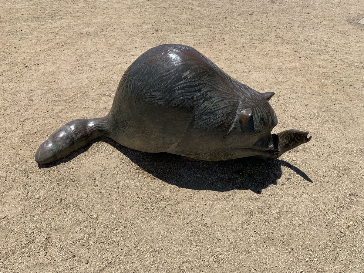 Metal bear or something eating a fish