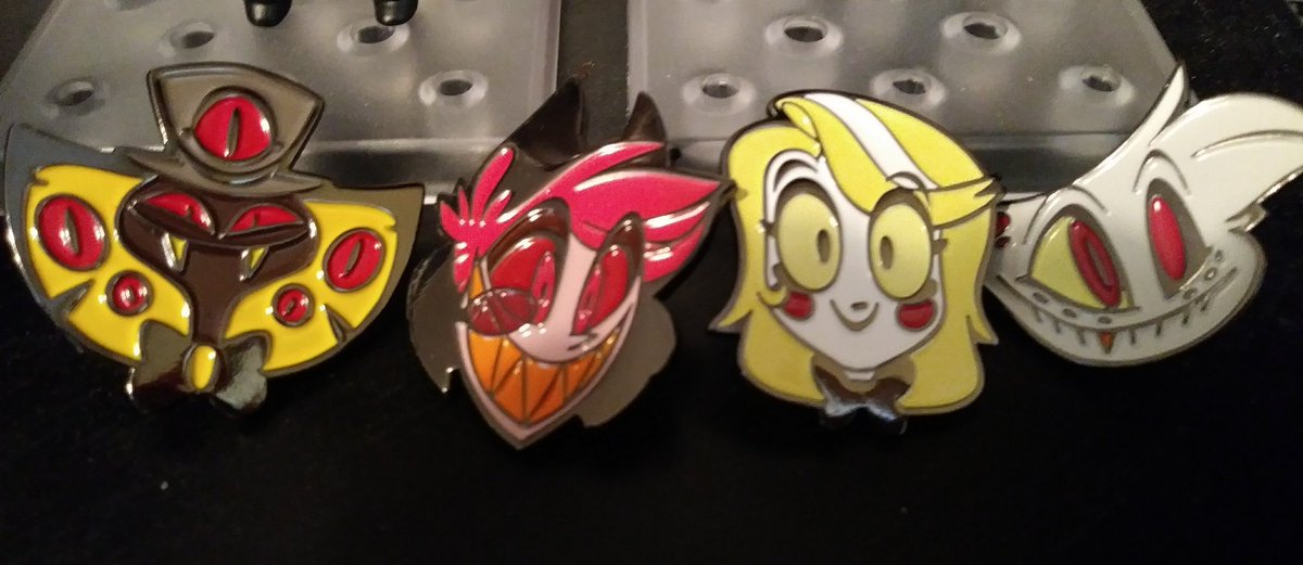 MatsuyukiYT's tweet photo. Got in my new #HazbinHotel merch! Forgot to tweet my last stuff, too, but I couldn't find the shirts, so the only one shown is my Alastor pin I got last time. Anyway I really love it all! @HazbinHotel @VivziePop https://t.co/1KgbXX3RAr