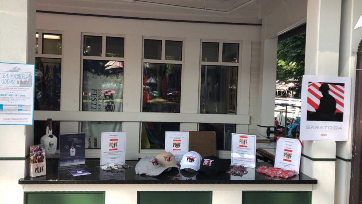 PDJFund's tweet photo. Stop by the Community Booth on the outside porch adjacent to the Saratoga Silks Room to check out the merchandise we have for sale to benefit our disabled riders. #PDJFDay https://t.co/oDVpUPPXNg