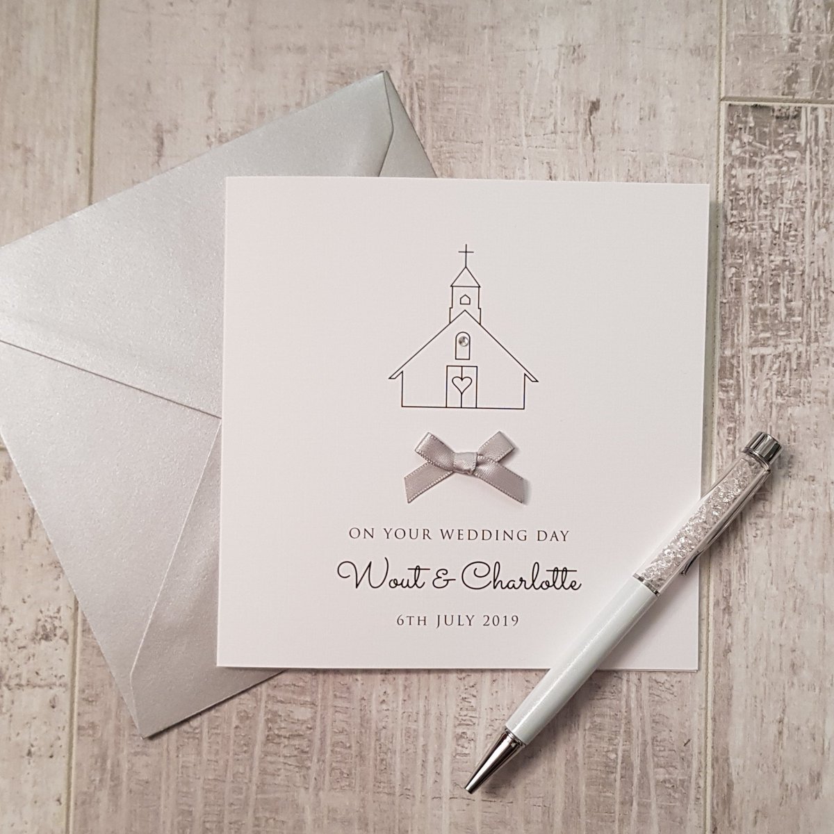 BuzibeeDesigns's tweet photo. A #personalised #weddingday card with simple chapel design embellished with a diamonte and satin ribbon bow https://t.co/ID569Uwu6d