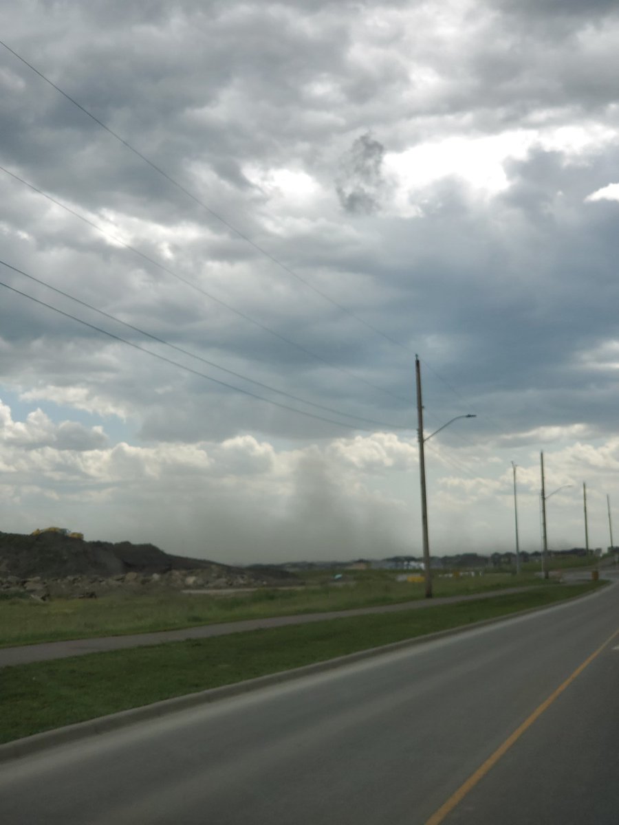 AgentSomerset's tweet photo. Another storm. View from 24st Airdrie. Insane wind. Signs and debris blowing around #ABStorm https://t.co/LZNJq8r4lh