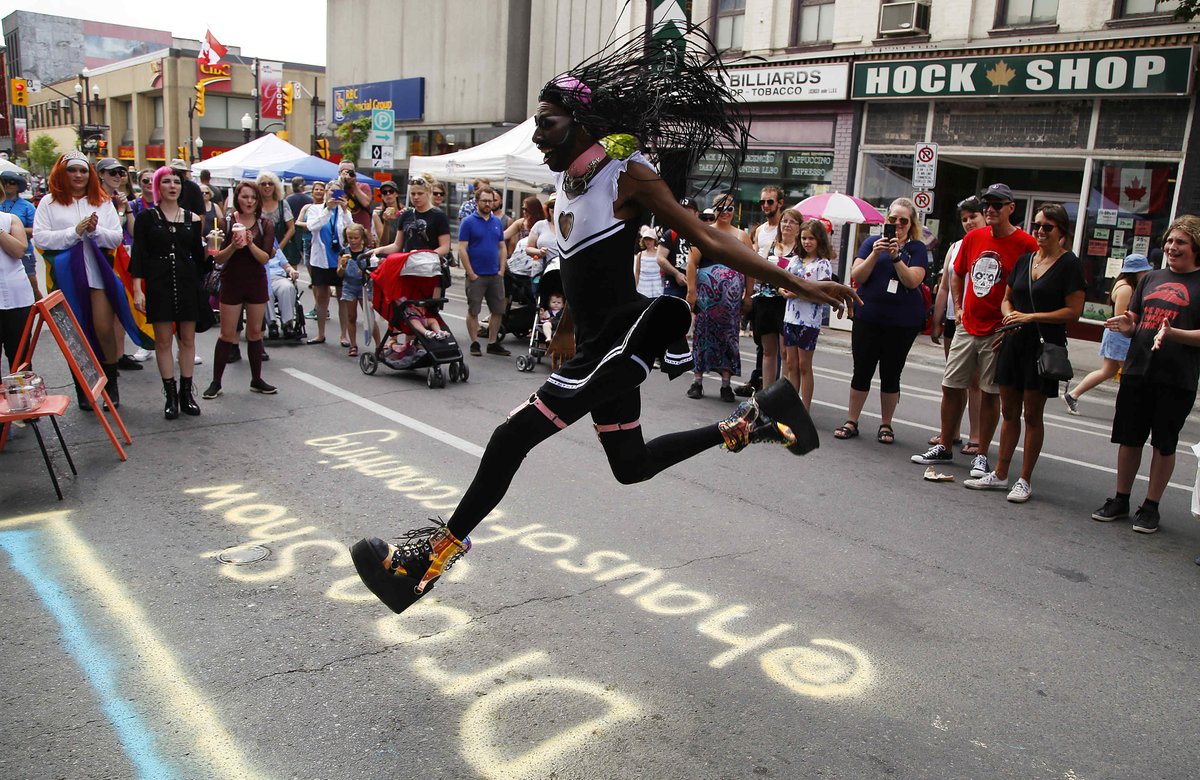 A crowd gather to watch a performance from drag queen Dixie Que during the return of @downtownPtbo <a href="/PTBOPulse/">PTBOPulse</a> in #PTBO, Ont. The annual downtown car-free street festival attracted hundreds of people.