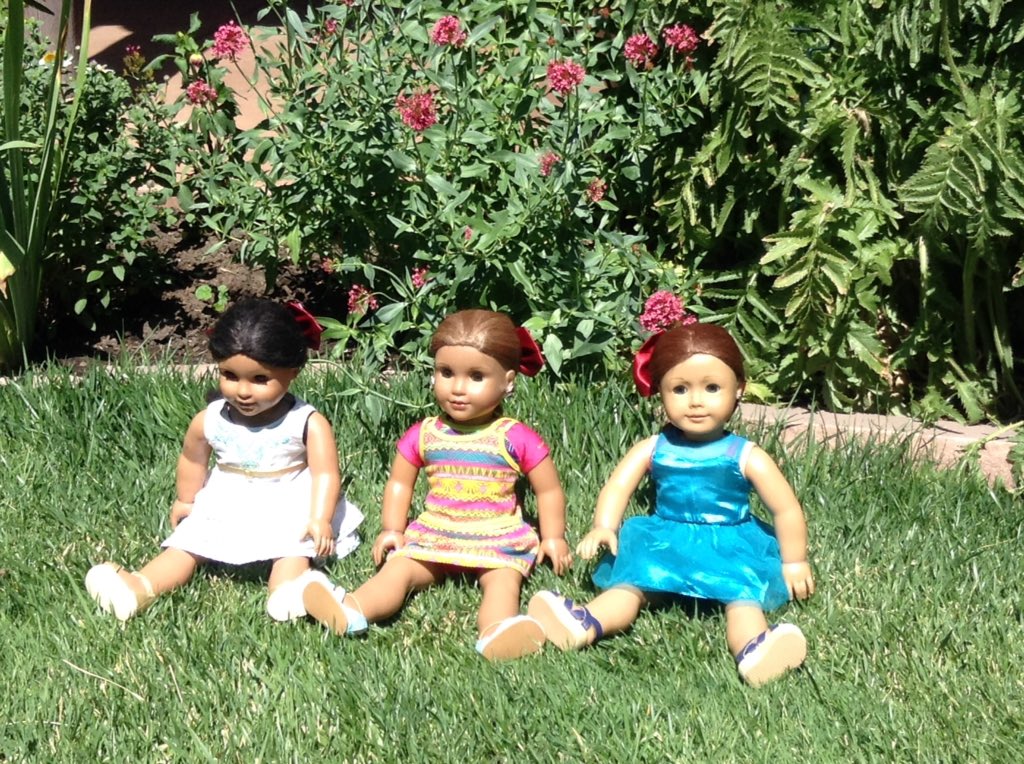 Oncer4L's tweet photo. Josefina, Saige and Lea enjoying the flowers in the garden at the New Mexico Museum of Art @American_Girl https://t.co/tNbdXnKvUi