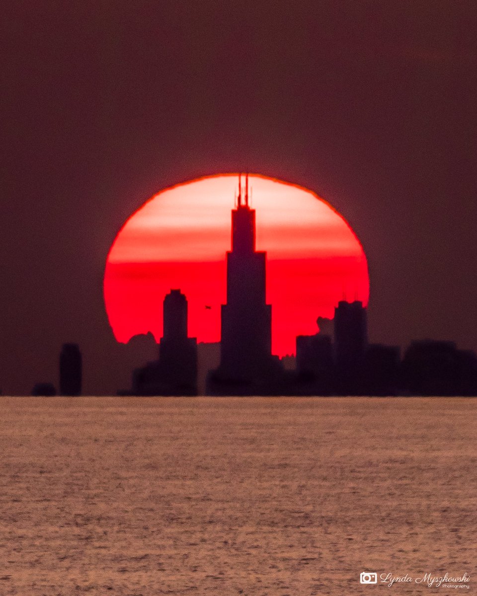 Bullseye! The sun sets behind the Sears (Willis) Tower in Chicago as shot from the Indiana Dunes this past Wednesday. I've been wanting to get this shot for a while and was excited that I timed it so perfectly. It was an amazing sight to see. #Chicago #sunset