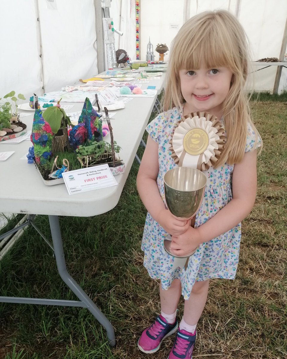 Harriet Chalk..winner of the John Ivey cup for best child's exhibit 2019 with her miniature garden, complete with seeded grass, cress vegetable patch, mini bunting, lights in the towers and so much more!